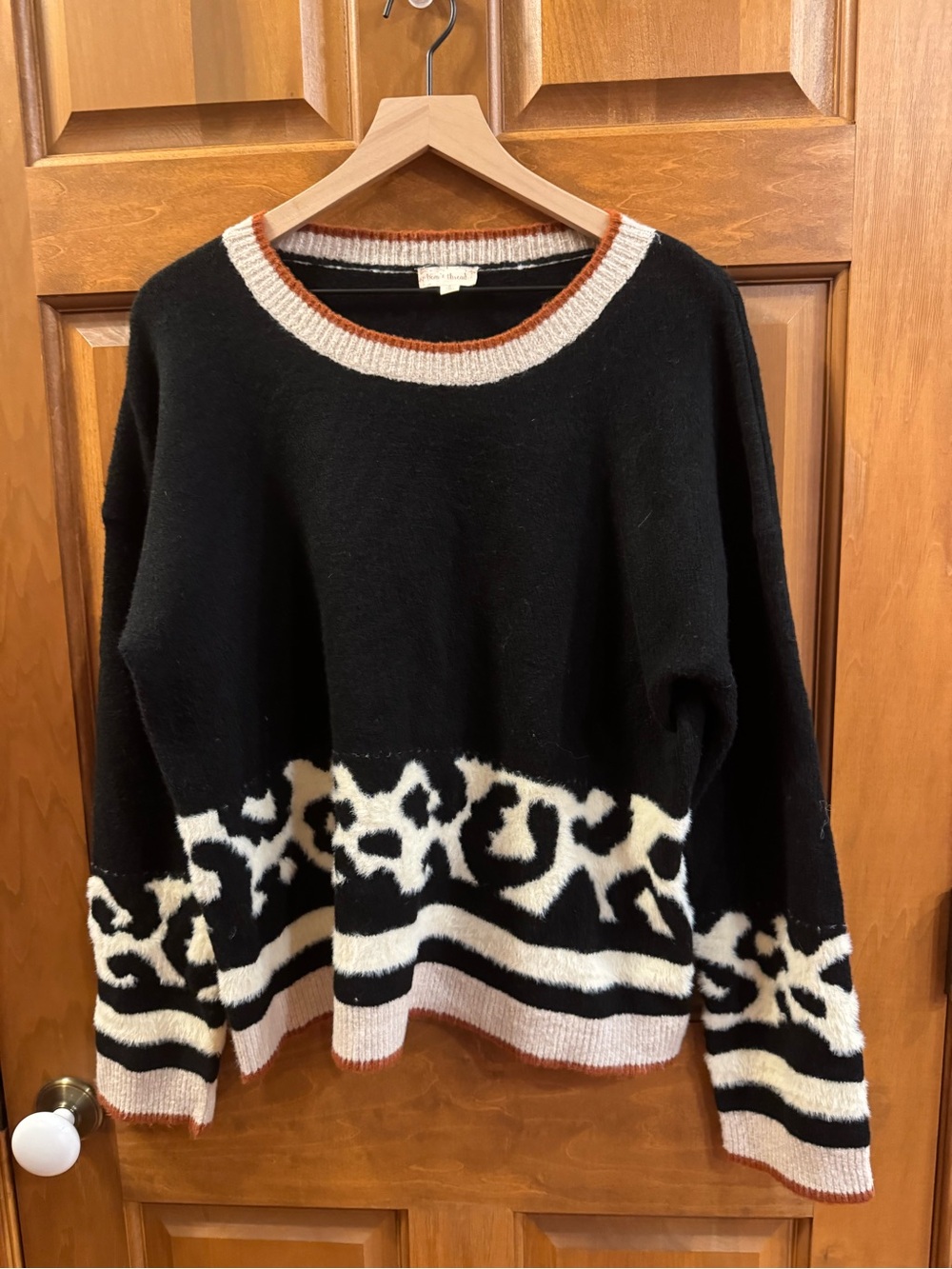 Hem & Thread Black Crewneck Sweater with Cream Leopard Border and Rust Trim
